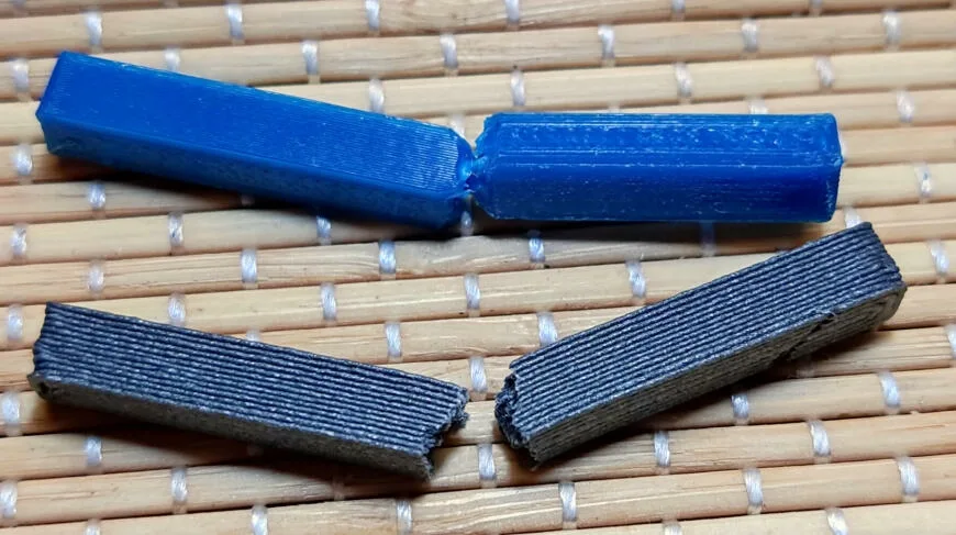 Сломанные бруски из чистого PETG и из угленаполненного композита